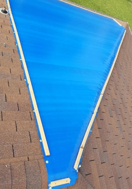 Professional Emergency Roof Tarping and Board Up Services by MRC Restoration to protect properties from further damage after storms fires or other emergencies