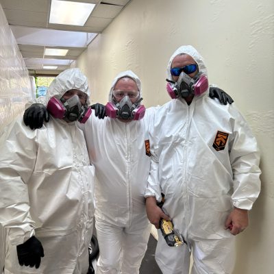 MRC Restoration team in protective suits performing mold removal services